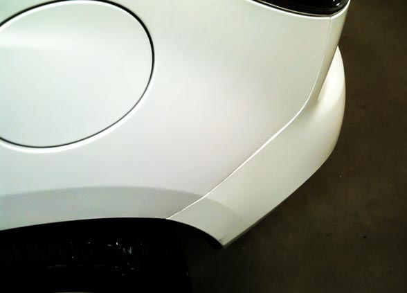 2010 Mazda CX-7 with dent in rear fender
