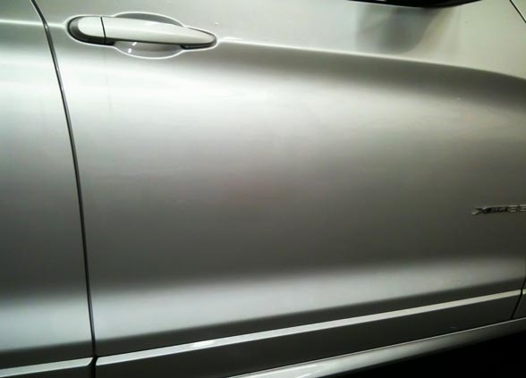 2013 BMW X3 dent in door panel